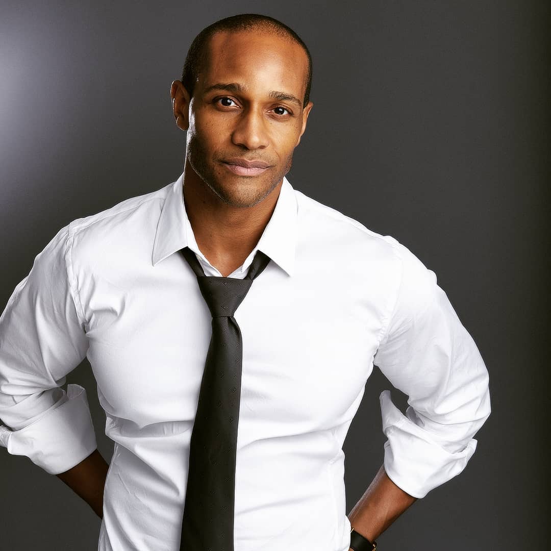 Michael Cory Davis in a white shirt and loosened black tie